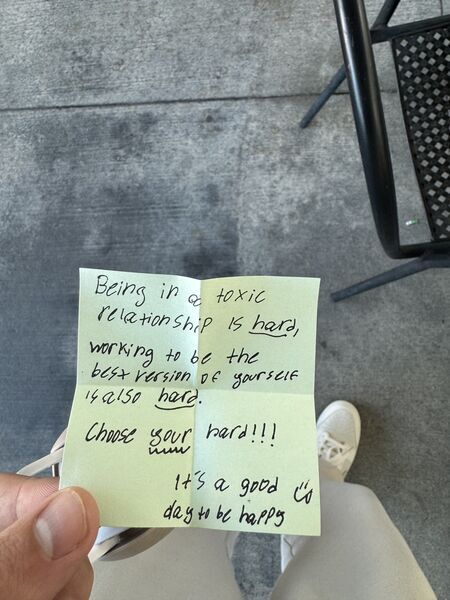 Handwritten sticky note with words of encouragement